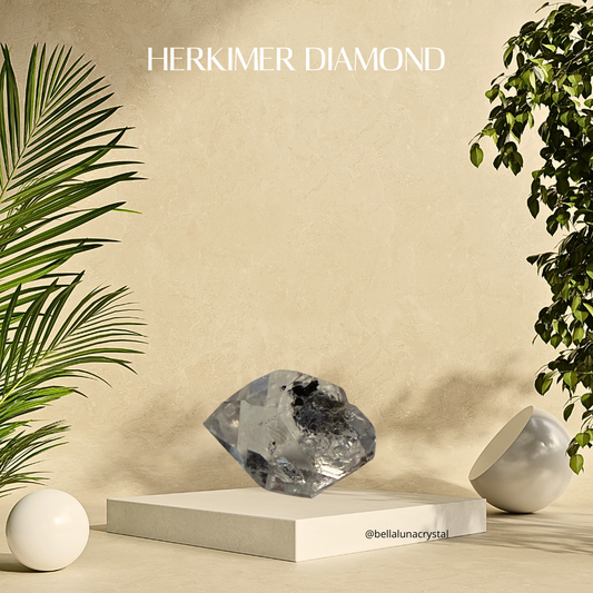 Herkimer diamond on a white pedestal with plants on a beige background, featuring the brand 'Herkimer Diamond'.