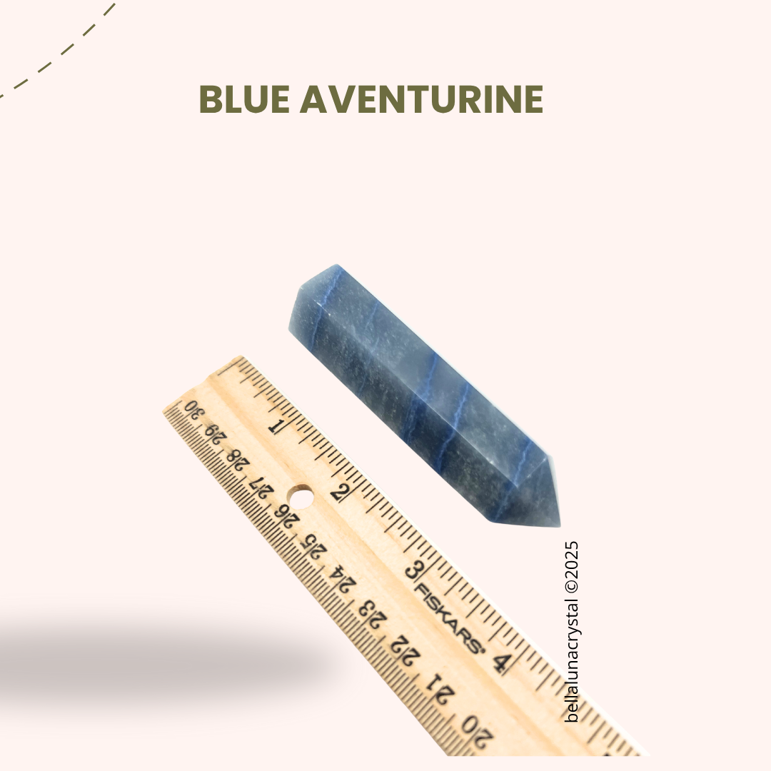 Blue aventurine crystal with a ruler for scale on a white background