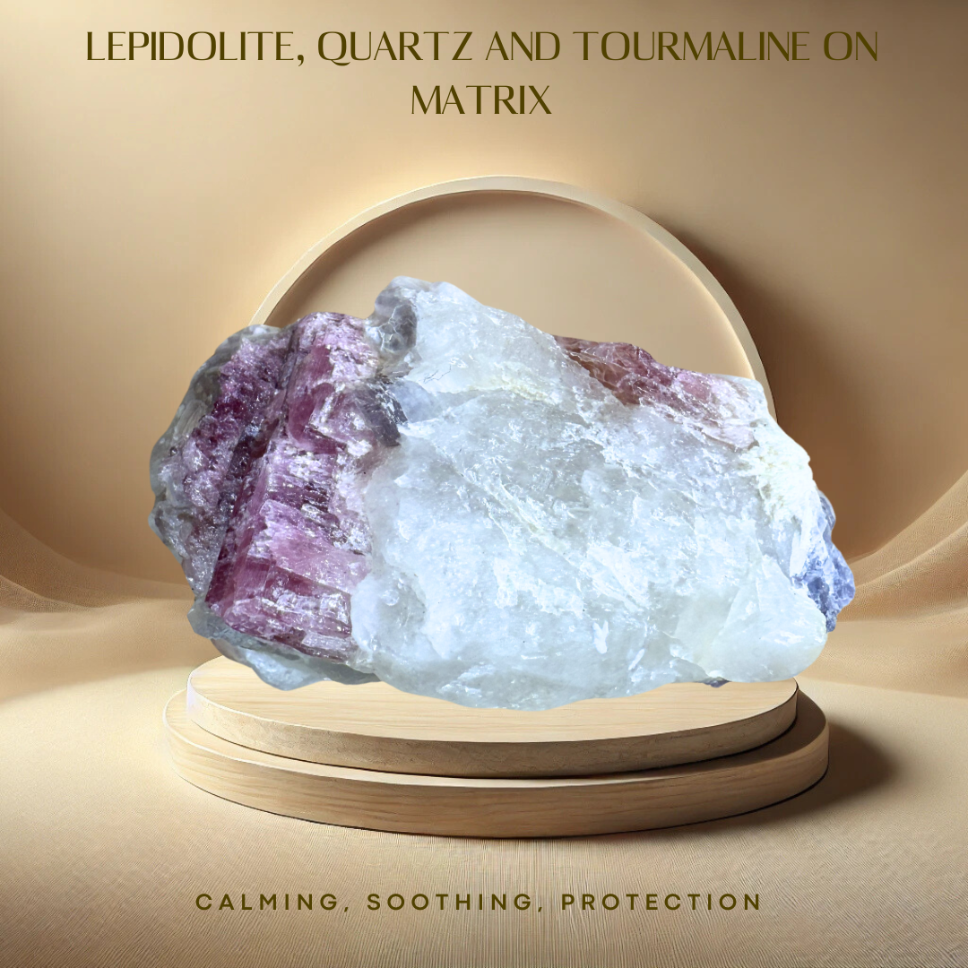 A rough Lepidolite, Quartz, and Tourmaline on Matrix crystal, predominantly purple in color, displayed on a wooden stand with a beige background.