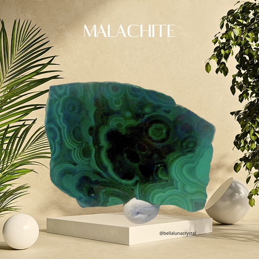 Malachite crystal on a stand with decorative elements and 'MALACHITE' text.