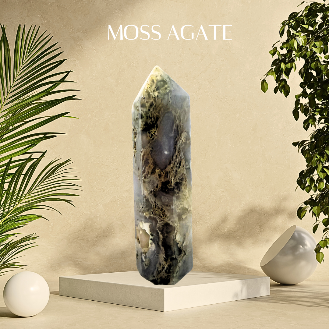 Moss agate crystal on a white pedestal with plants on a beige background