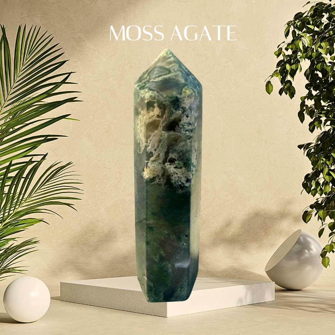 Moss Agate crystal on a white pedestal with plants and a beige background, featuring the brand 'Moss Agate'.