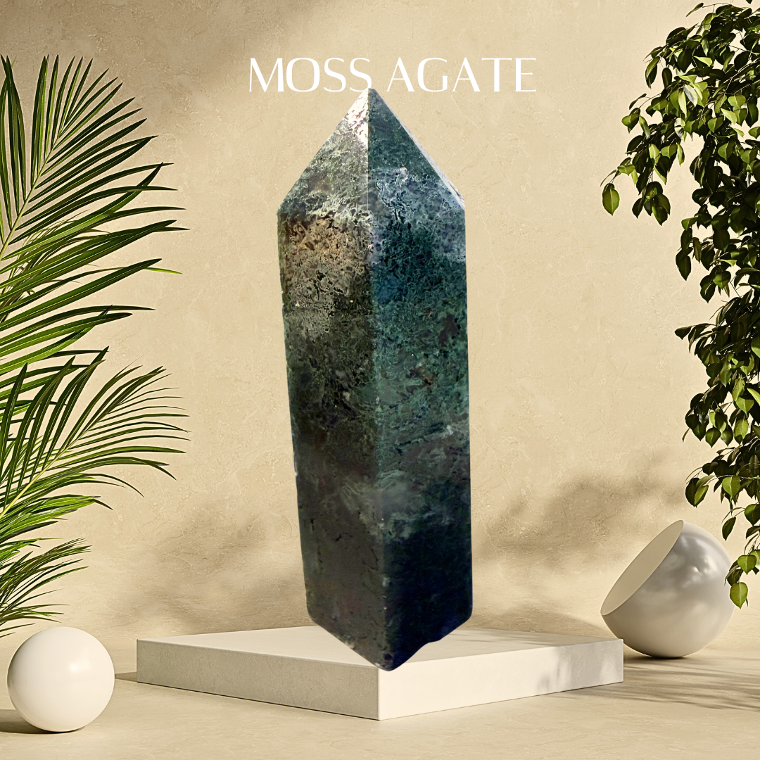 Moss Agate crystal on a white pedestal with plants on a beige background