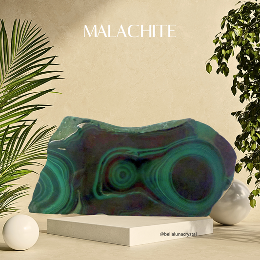 Malachite stone on a stand with plants and a neutral background
