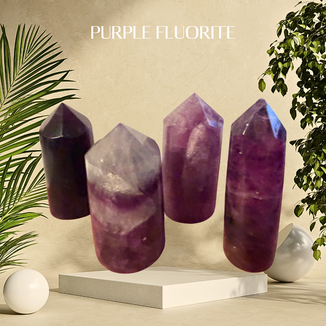 Purple fluorite crystals on a beige background with green plants