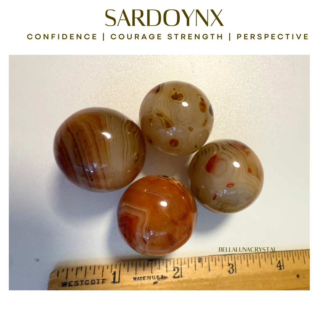 Four marbled stones with a ruler for scale on a light background, featuring the brand 'Sardonyx'.