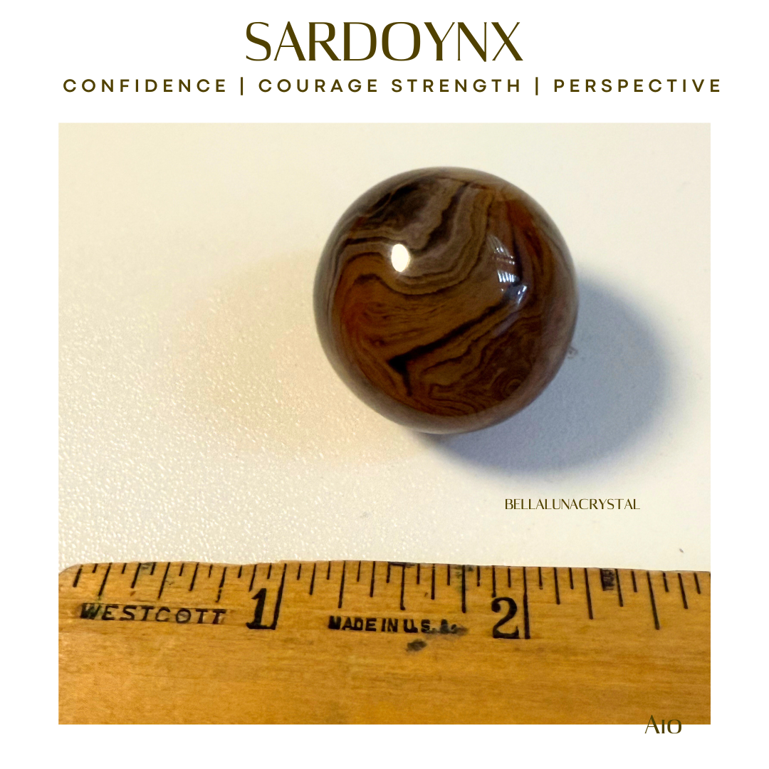 Brown marbled stone with Sardonyx properties on a beige background, ruler for scale.