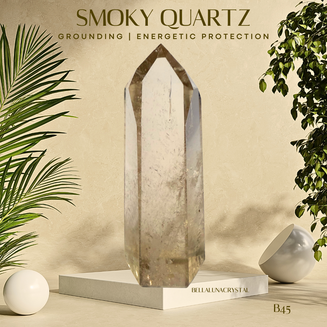 Smoky quartz crystal on a beige background with plants