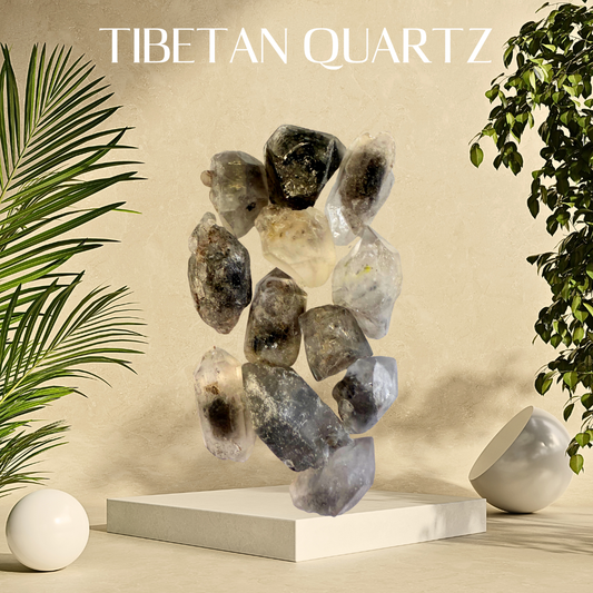 Tibetan quartz stones on a beige platform with plants on either side