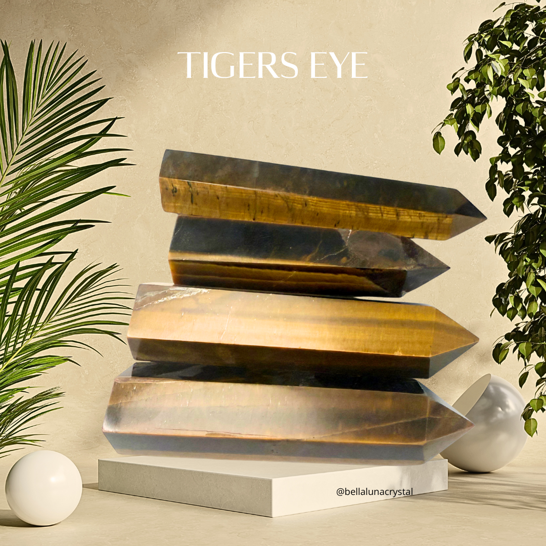 Stack of tigers eye crystals on a neutral background with plants